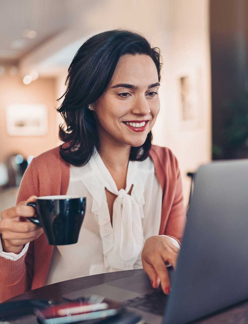 woman looking at SouthState checking account with free online banking
